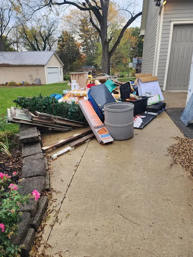 Dumpster being loaded with debris for Roofing Dumpster Rental in Fruitland